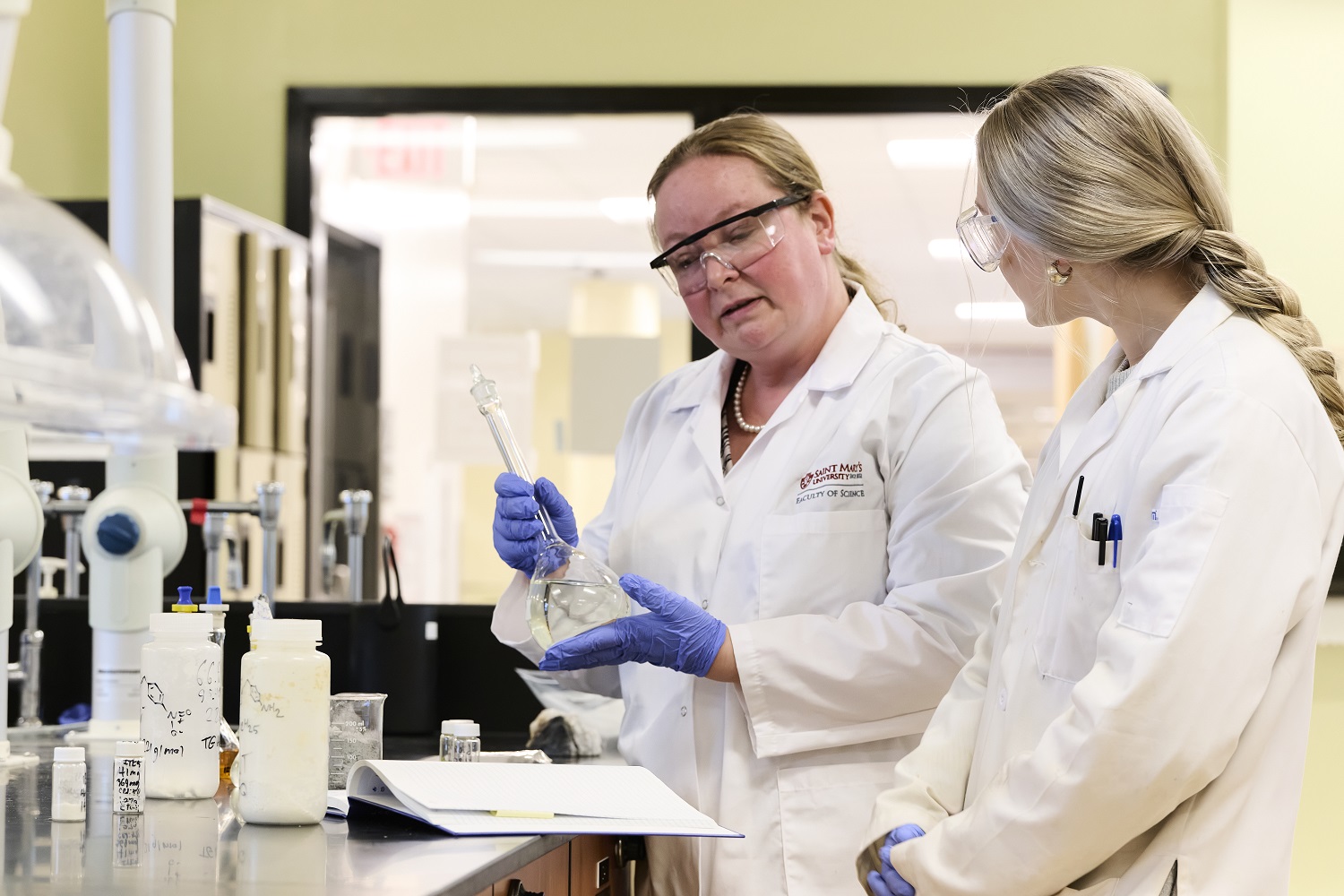Dr, Christa  Brosseau in the lab with student
