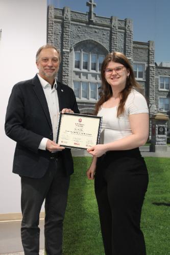 Deana accepting the SLRA certificate