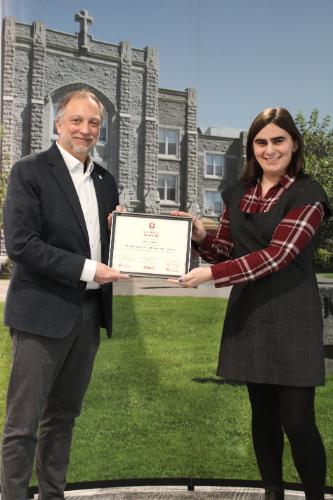 Emily accepting the SLRA certificate