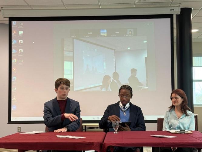 Honours candidates Ian Hiltz, D’Andre Farrell, Rae Millis sitting at a table