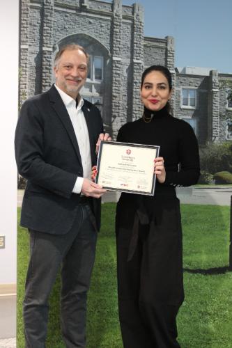 Reihaneh accepting the SLRA certificate